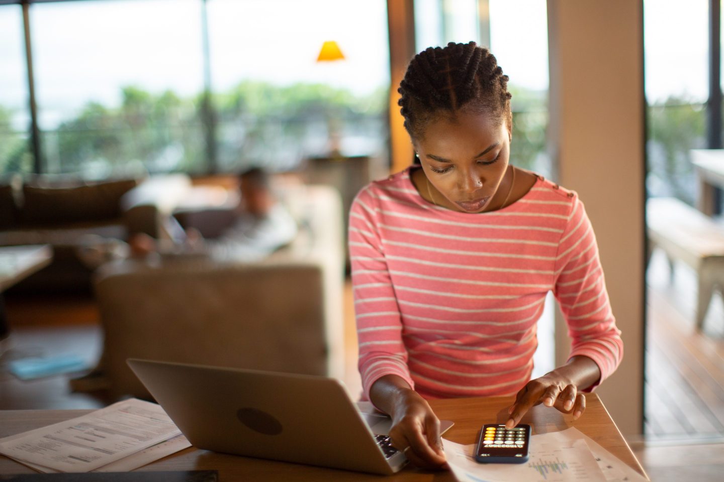 Young woman working on home finances