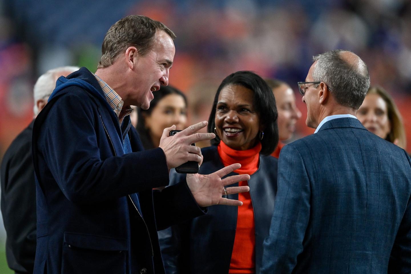 Peyton Manning and Condoleezza Rice at a football gam