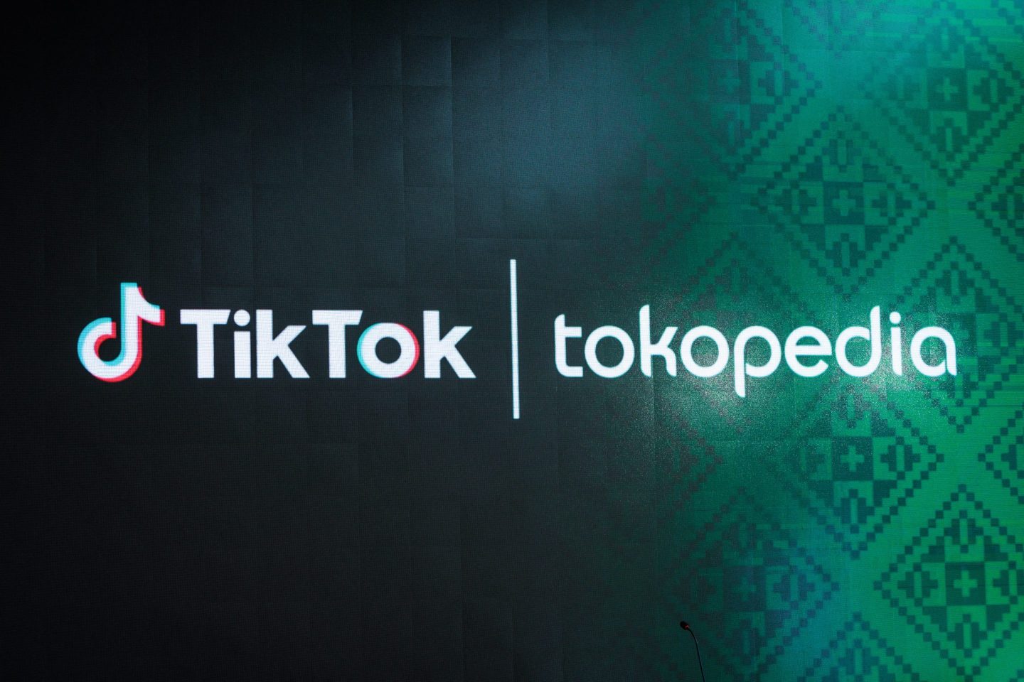 The logos of the social media video sharing app TikTok and Indonesia's leading e-commerce site Tokopedia