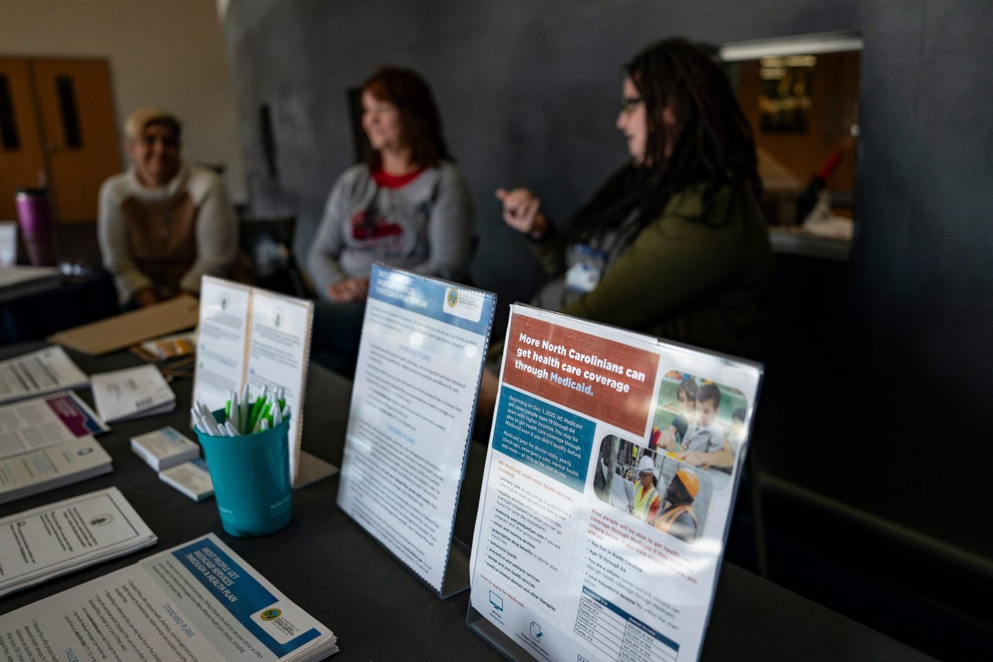 Informational brochures on Medicaid expansion during an event held by New Hanover County Department of Health and Human Services at a library in Wilmington, N.C., on Dec.16, 2023. North Carolina's expansion of Medicaid began on December 1st, and its estimated that more than 600,000 people statewide are now eligible for healthcare coverage that they otherwise could not afford.
