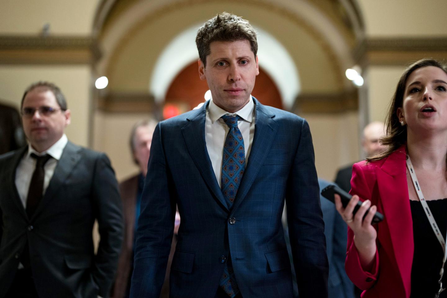 OpenAI CEO Sam Altman walking in the U.S. Capitol