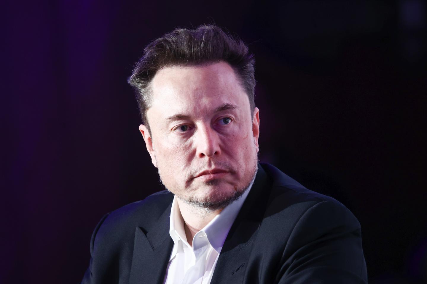 Elon Musk in a suit