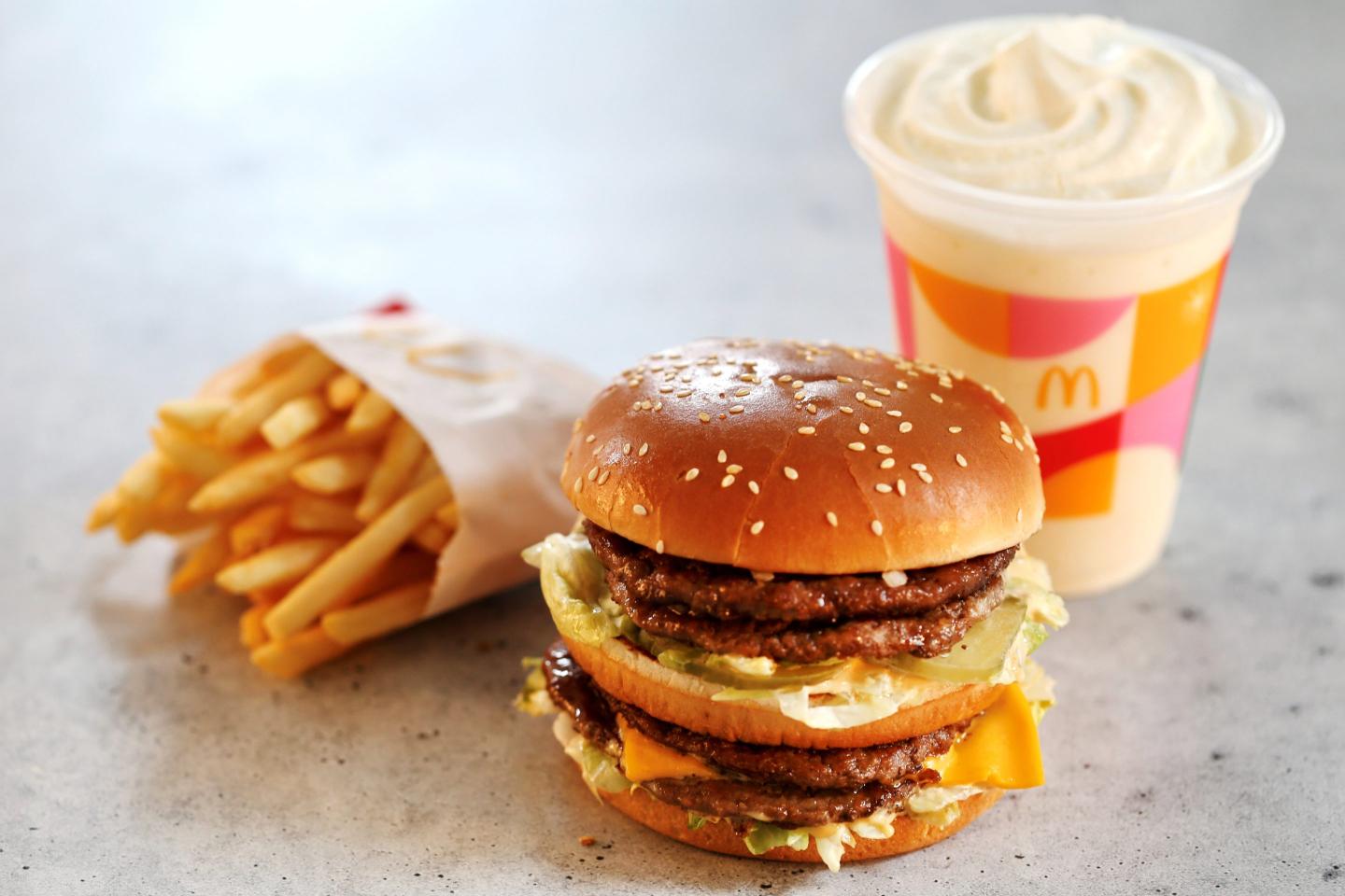 A Double Big Mac, fries, and milkshake sit on a counter.