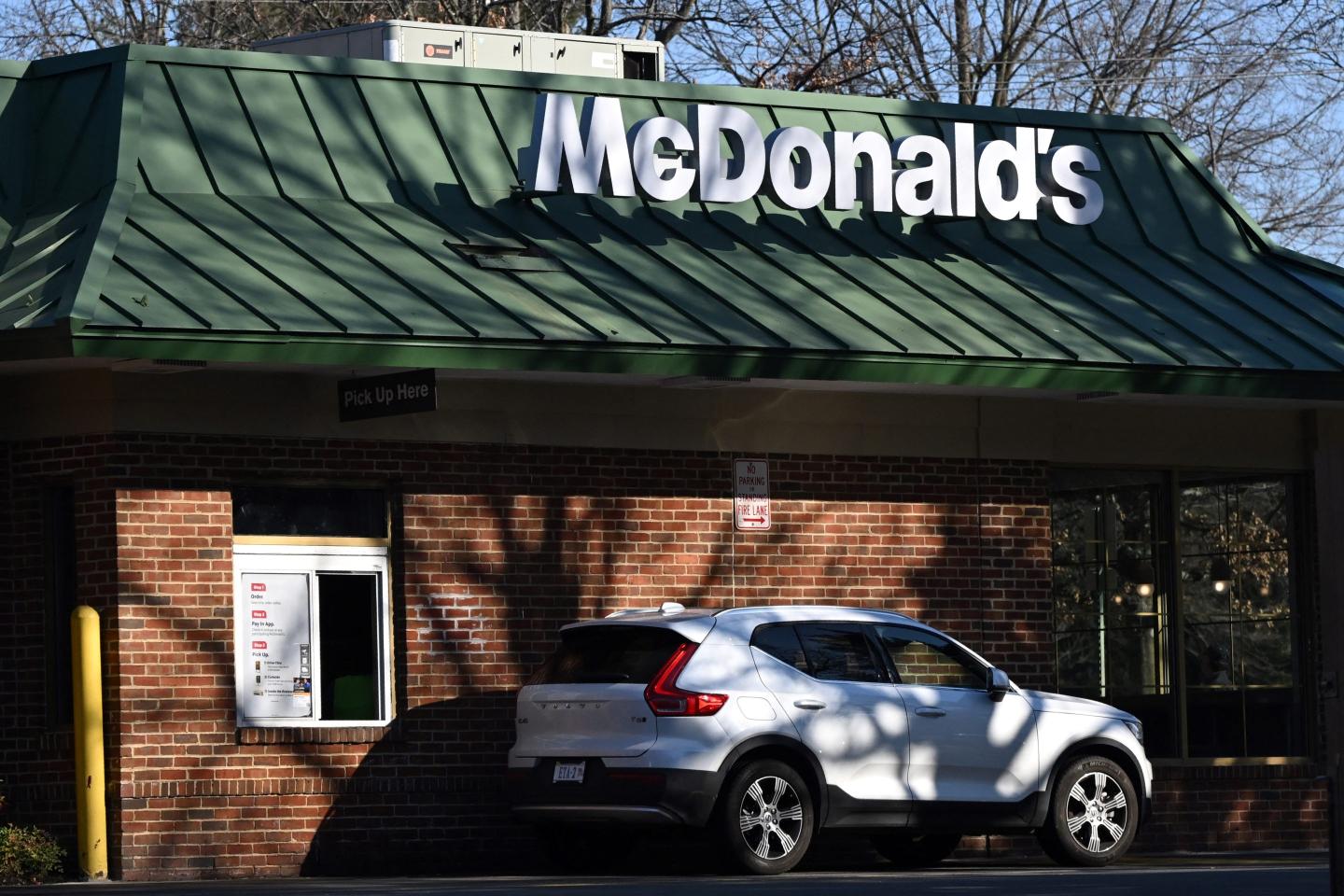A car stands at a drive-through at a McDonald's