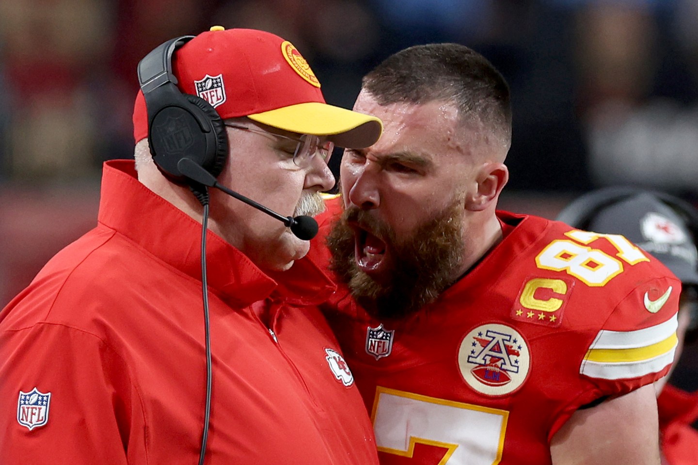 Travis Kelce, #87 of the Kansas City Chiefs, reacts at Head coach Andy Reid in the first half against the San Francisco 49ers during Super Bowl LVIII.