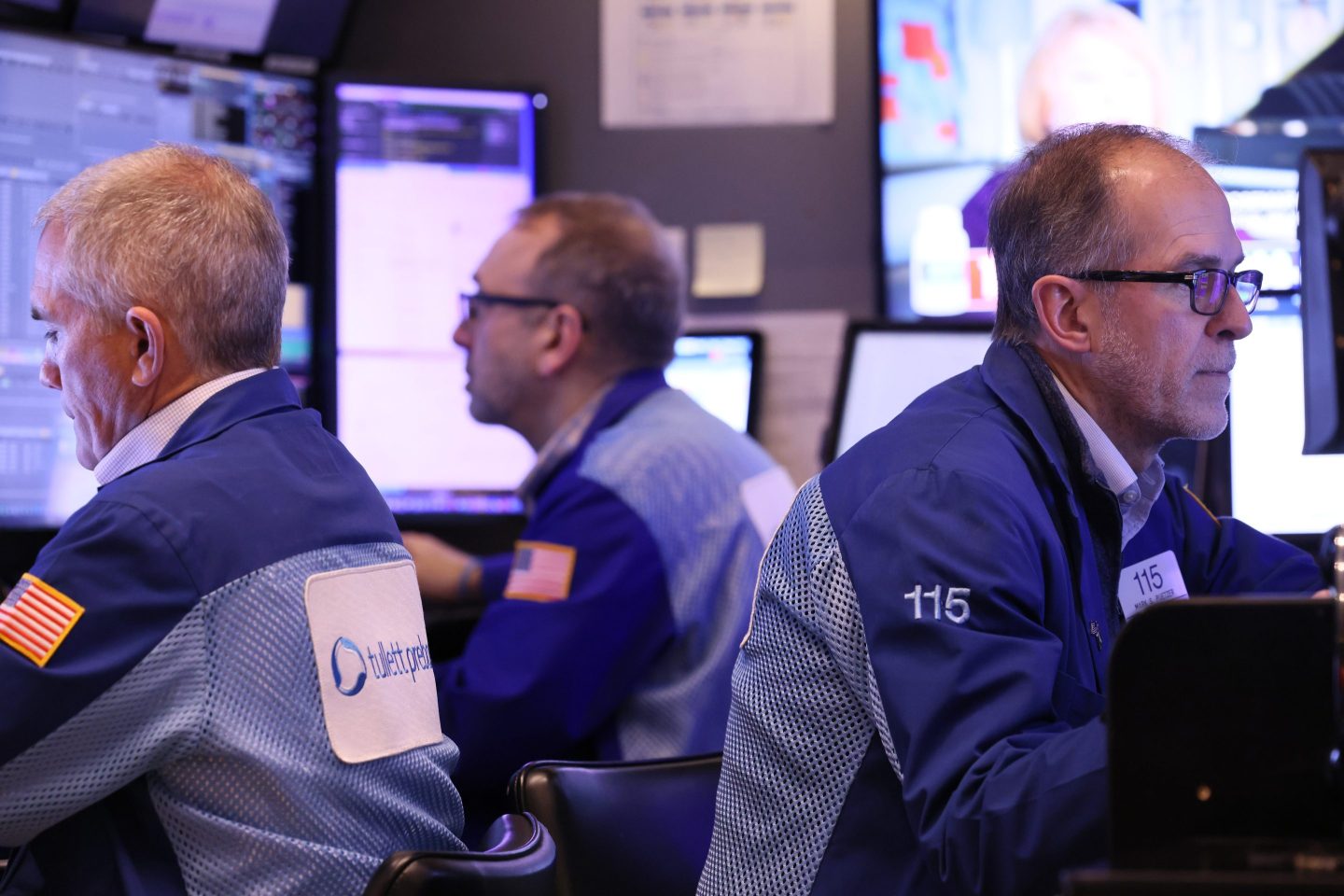 Traders work on the floor of the New York Stock Exchange during morning trading.