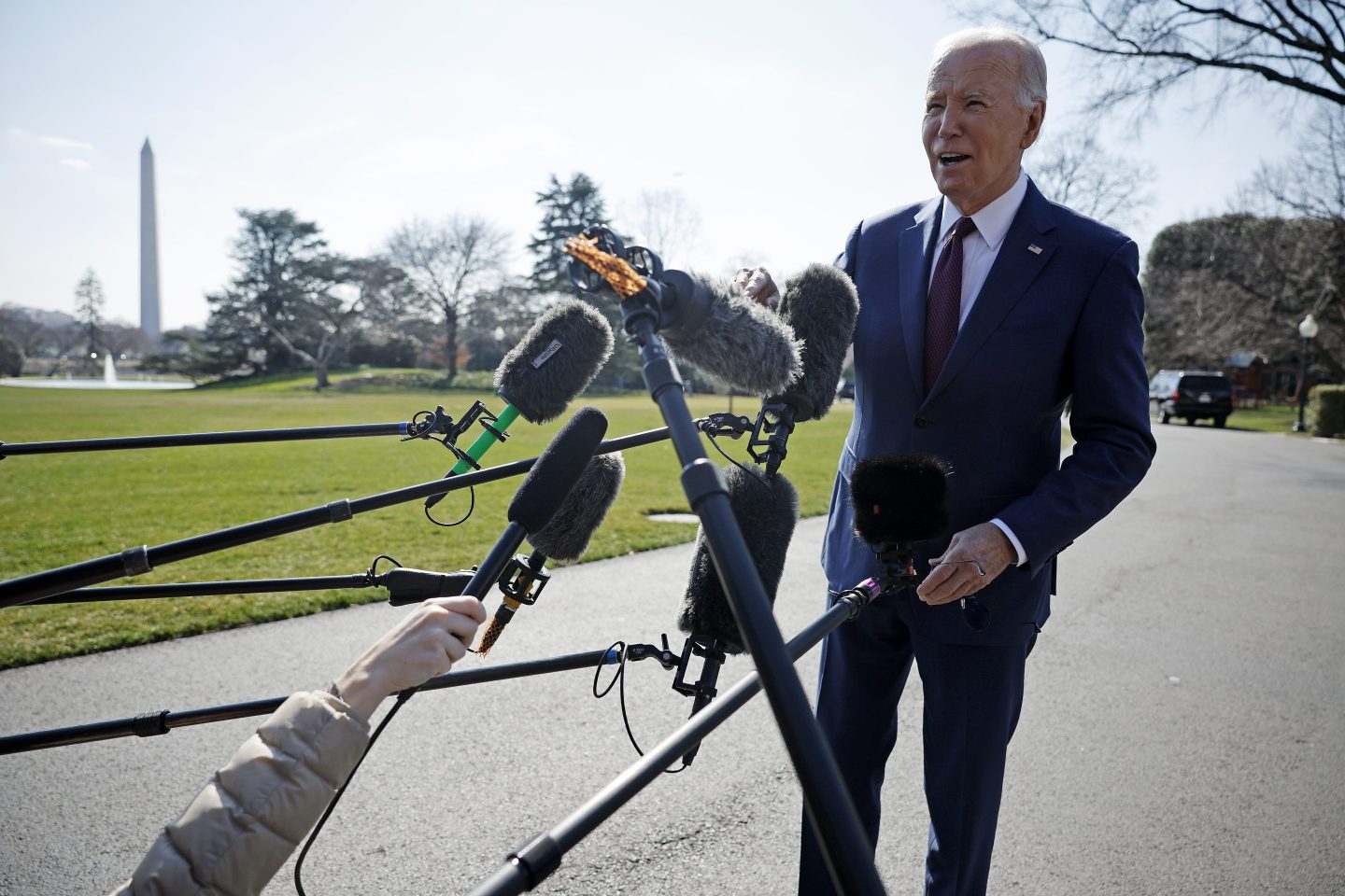 President Joe Biden stops to talk to journalists about new Russian sanctions as he departs the White House on Feb. 20, 2024 in Washington, DC.