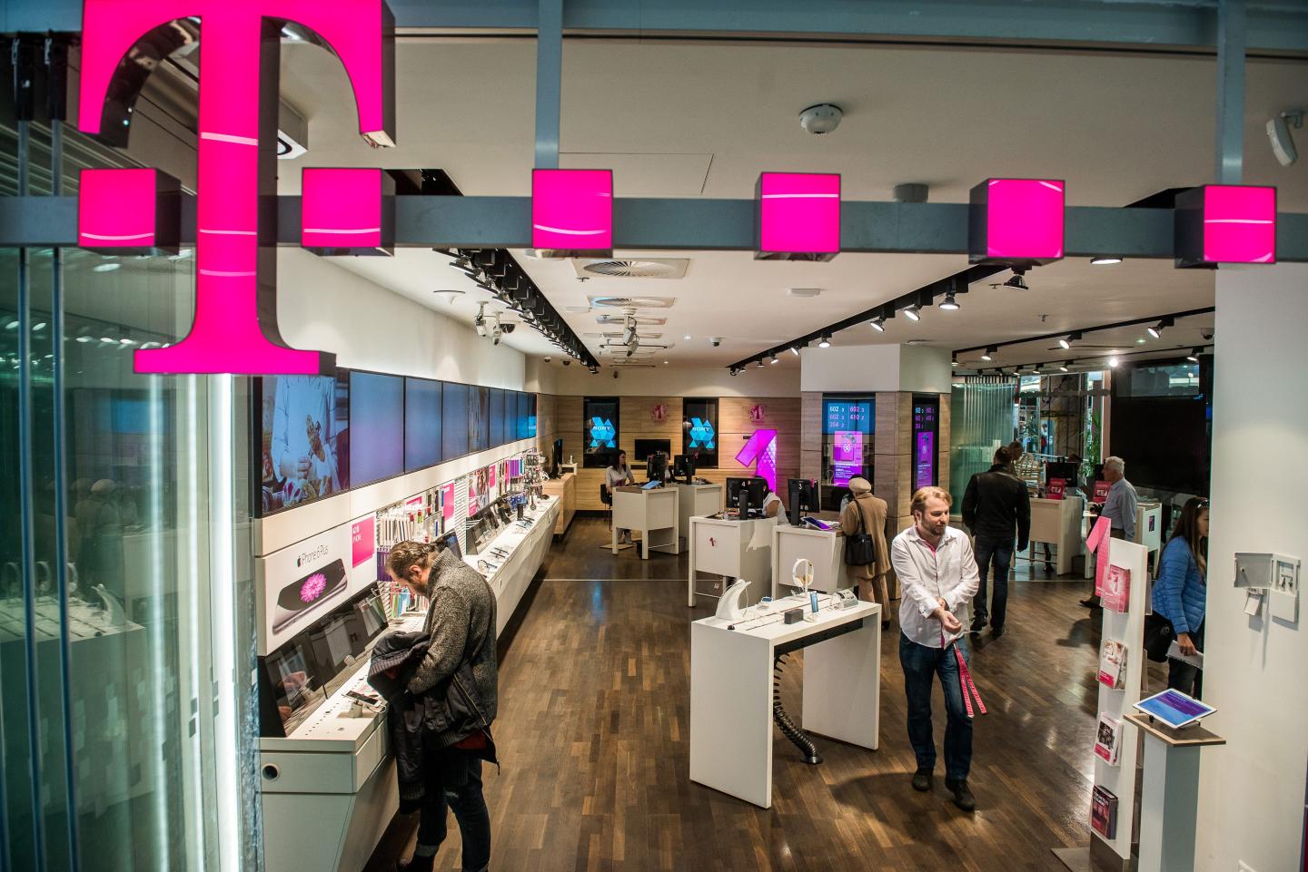 people browsing phones in a store