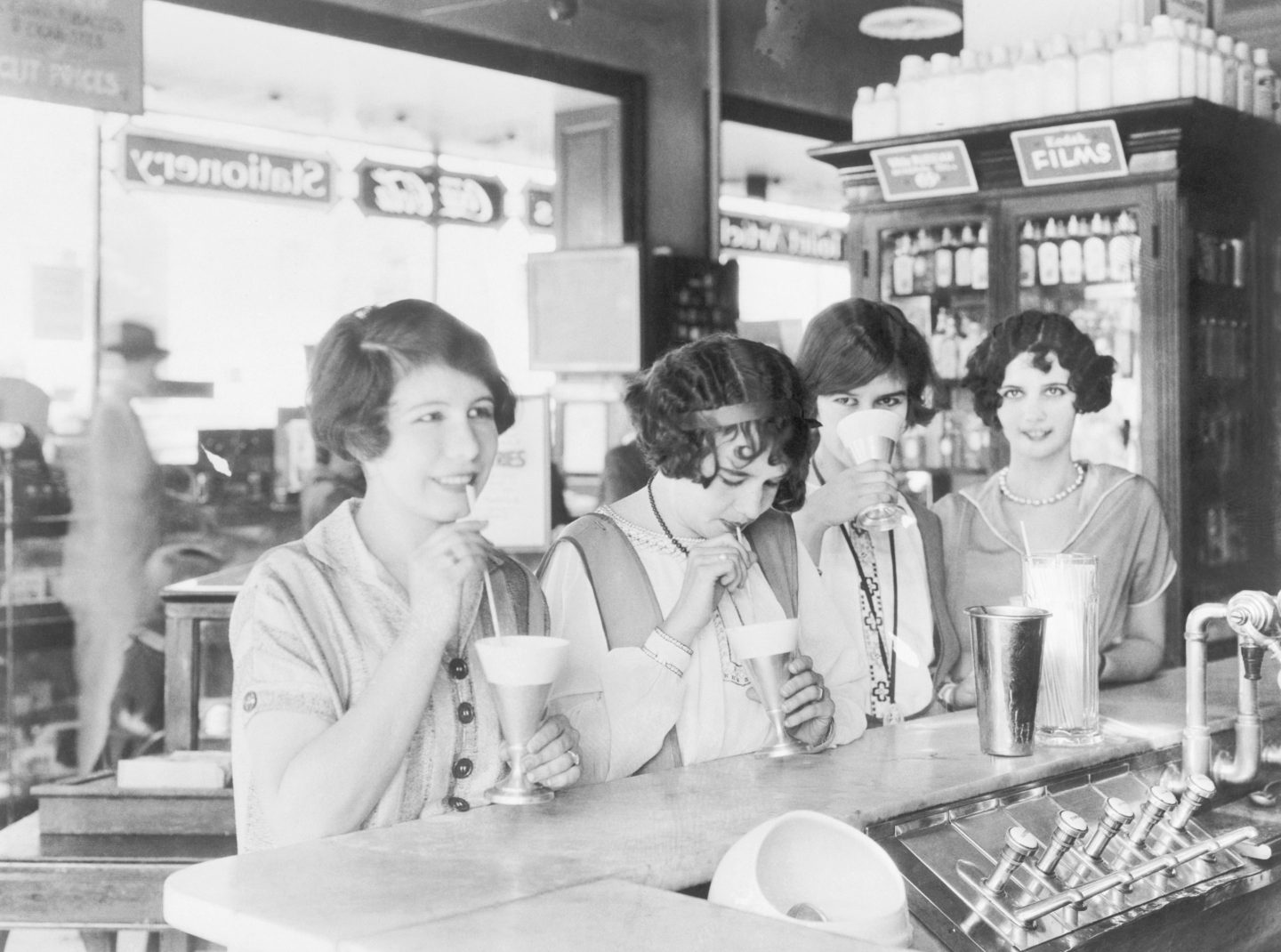 vintage photo of women drinking milkshakes