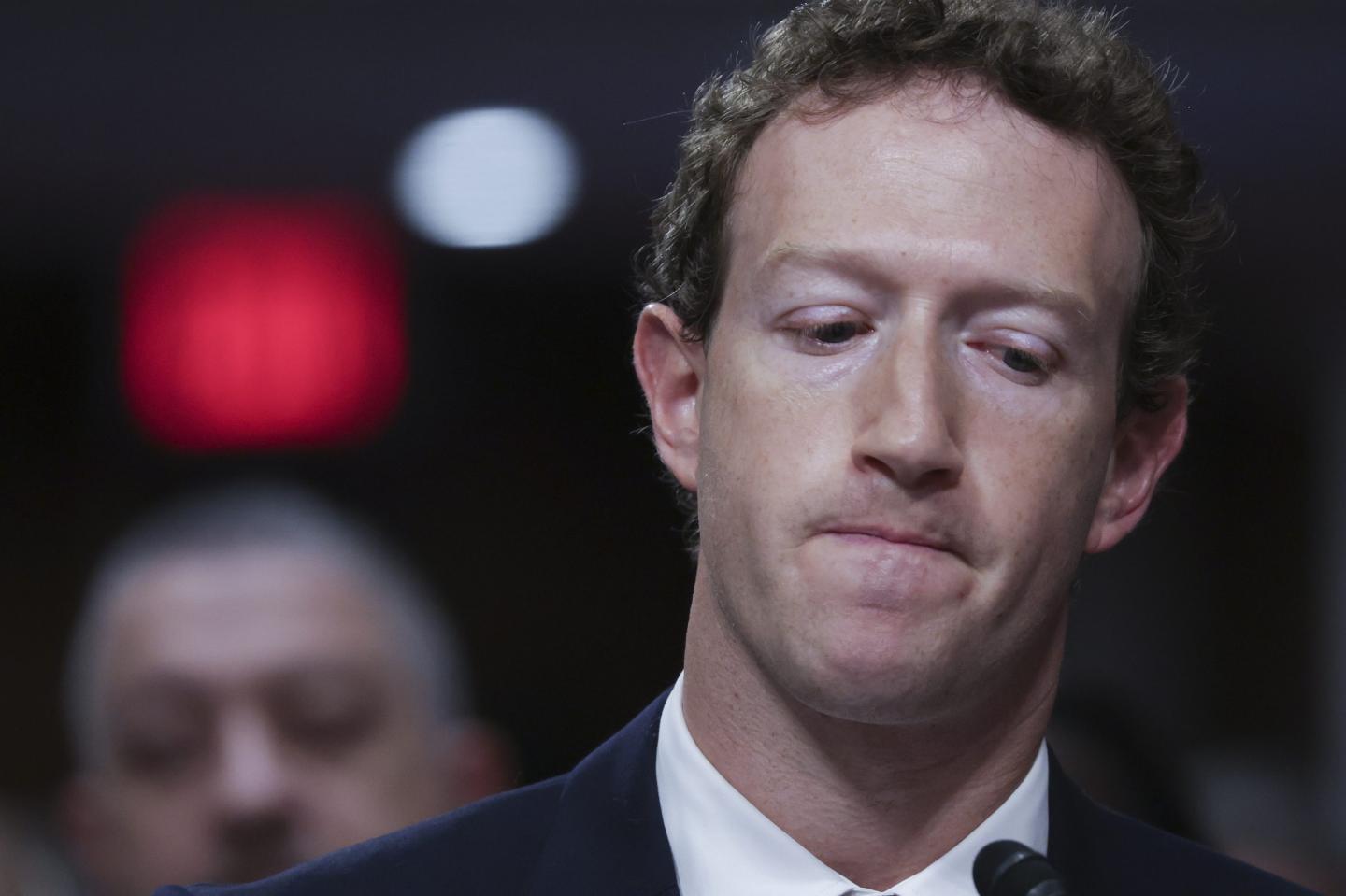 Mark Zuckerberg, CEO of Meta, frowns sadly as testifies before the Senate Judiciary Committee