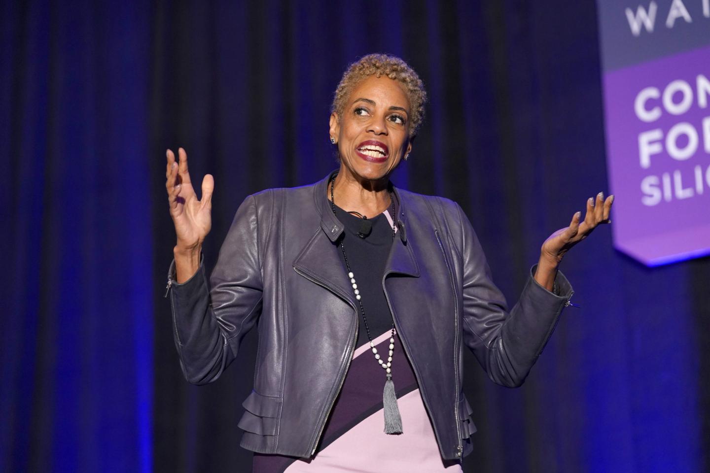 Vernā Myers speaks on stage