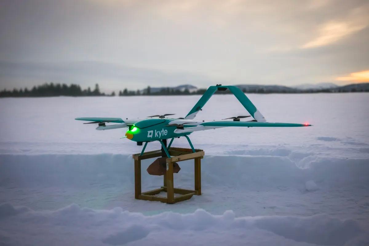 A picture of Aviant's Kyte drone in the middle of a snow-covered field.
