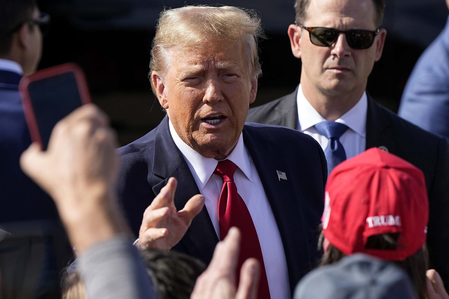 Republican presidential candidate former president Donald Trump speaks to supporters after arriving to Cerulean General Aviation, on Feb. 20, 2024, in Greer, S.C.