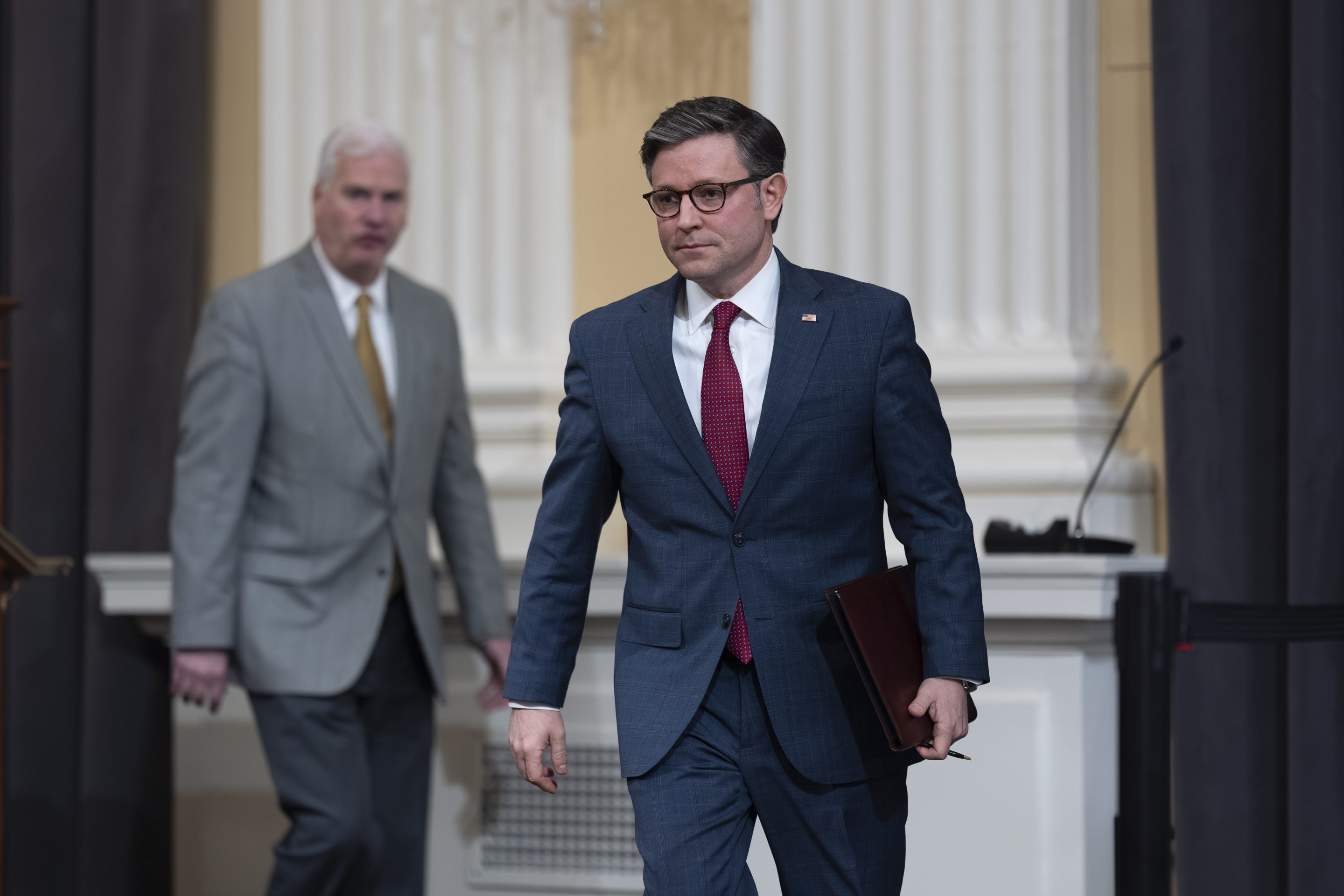 Speaker of the House Mike Johnson, R-La., right, arrives to meet with reporters at the Capitol in Washington, March 6, 2024.  