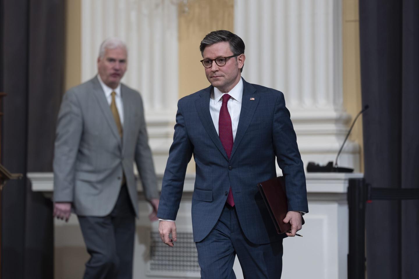 Speaker of the House Mike Johnson, R-La., right, arrives to meet with reporters at the Capitol in Washington, March 6, 2024.  