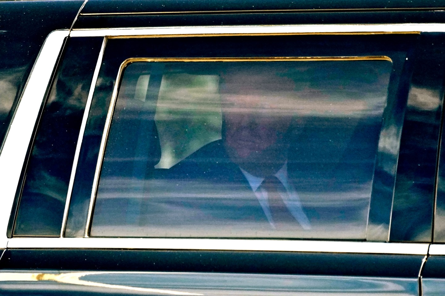 Former President Donald Trump waves to supporters as he leaves federal court, on March 14, 2024, in Fort Pierce, Fla.