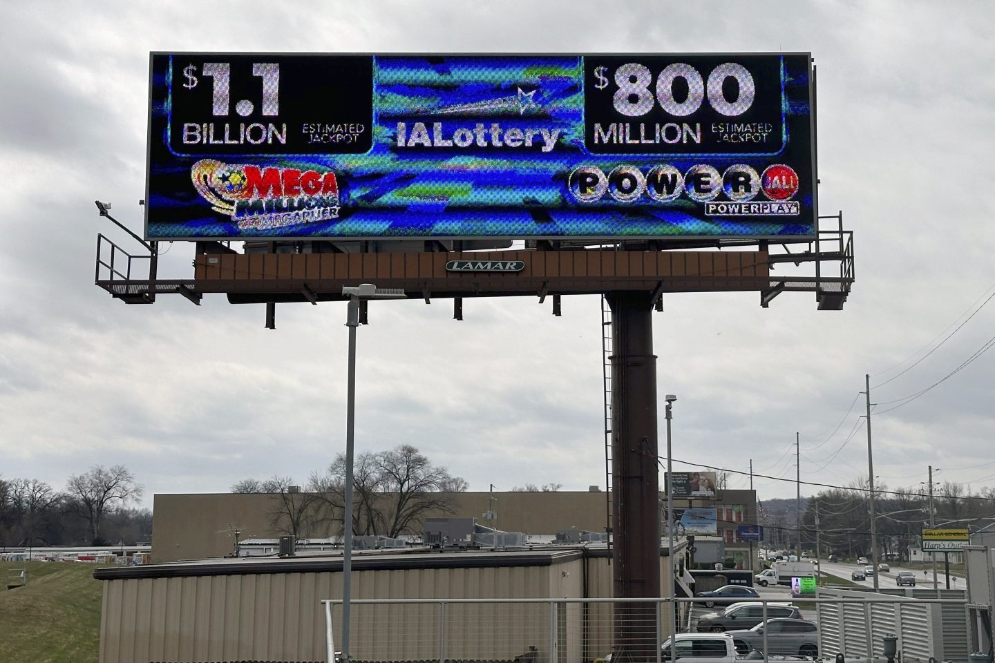 An electronic billboard advertises the Mega Millions and Powerball jackpots, Monday, March 25, 2024, in in Des Moines.
