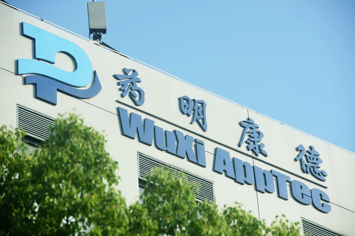 WuXi AppTec logo displayed on the facade of a company building in Shanghai.