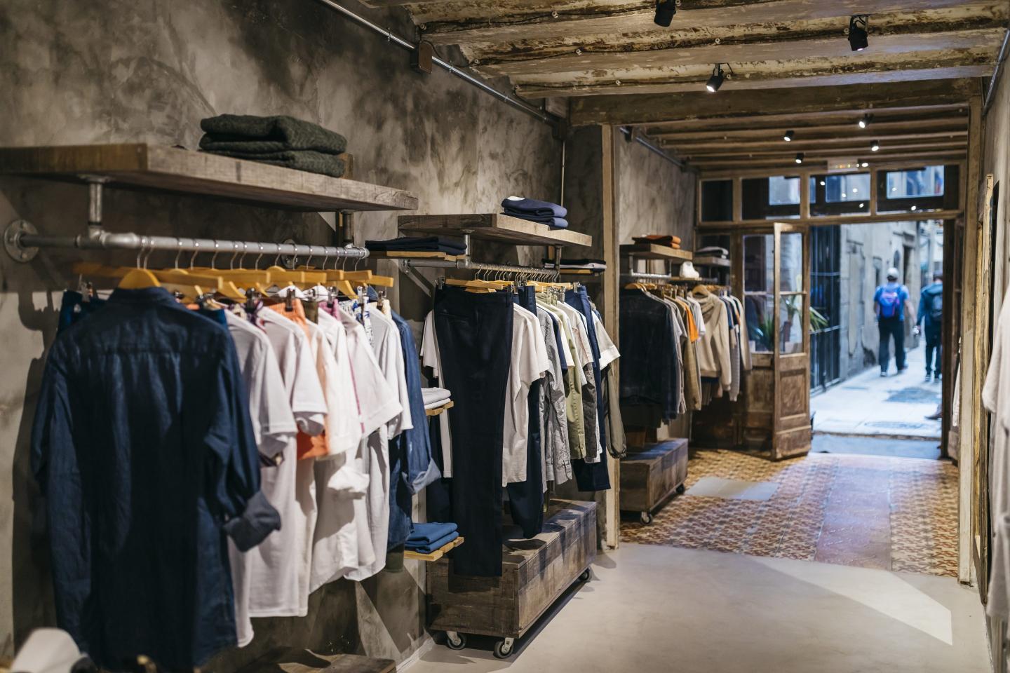 a row of shirts lined in a store
