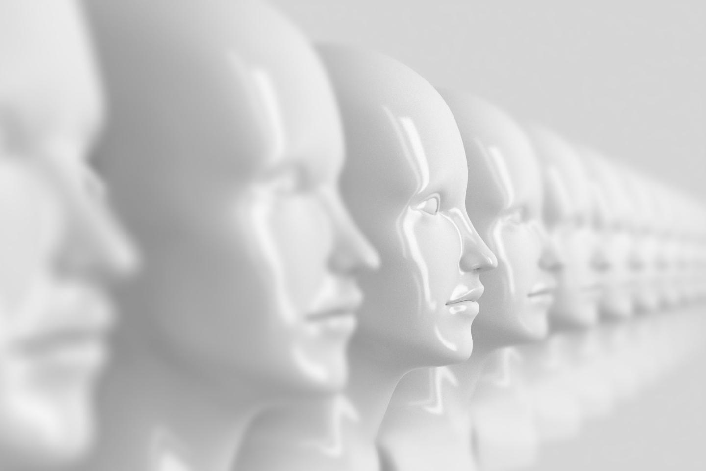 A photo showing identical out-of-focus female doll faces