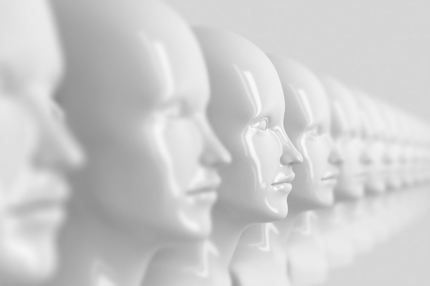 A photo showing identical out-of-focus female doll faces