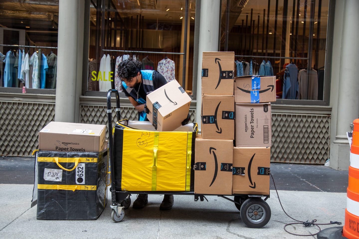A worker delivers Amazon packages in New York City.