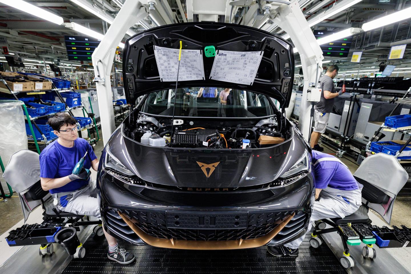 Workers assemble the Cupra Born electric car from automaker Volkswagen