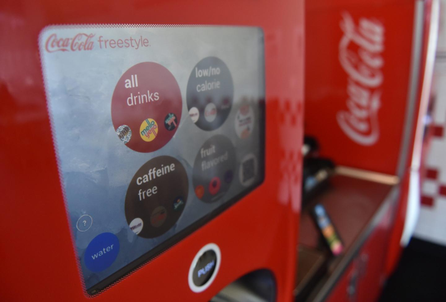 Wait, why is there a camera hole in that Coke vending machine?