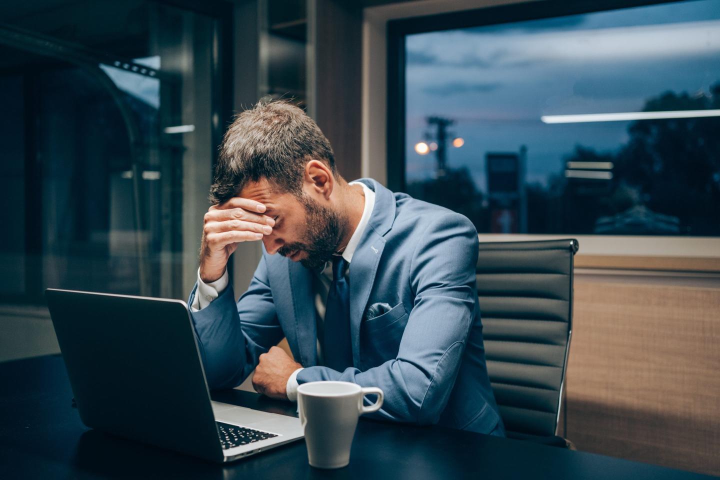 stressed man at computer