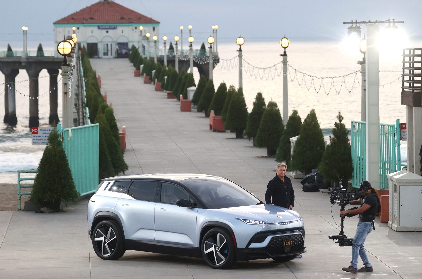 Fisker Inc. CEO Henrik Fisker stands with the Fisker Ocean all-electric SUV after it is was revealed on Nov. 16, 2021 in Manhattan Beach, California.