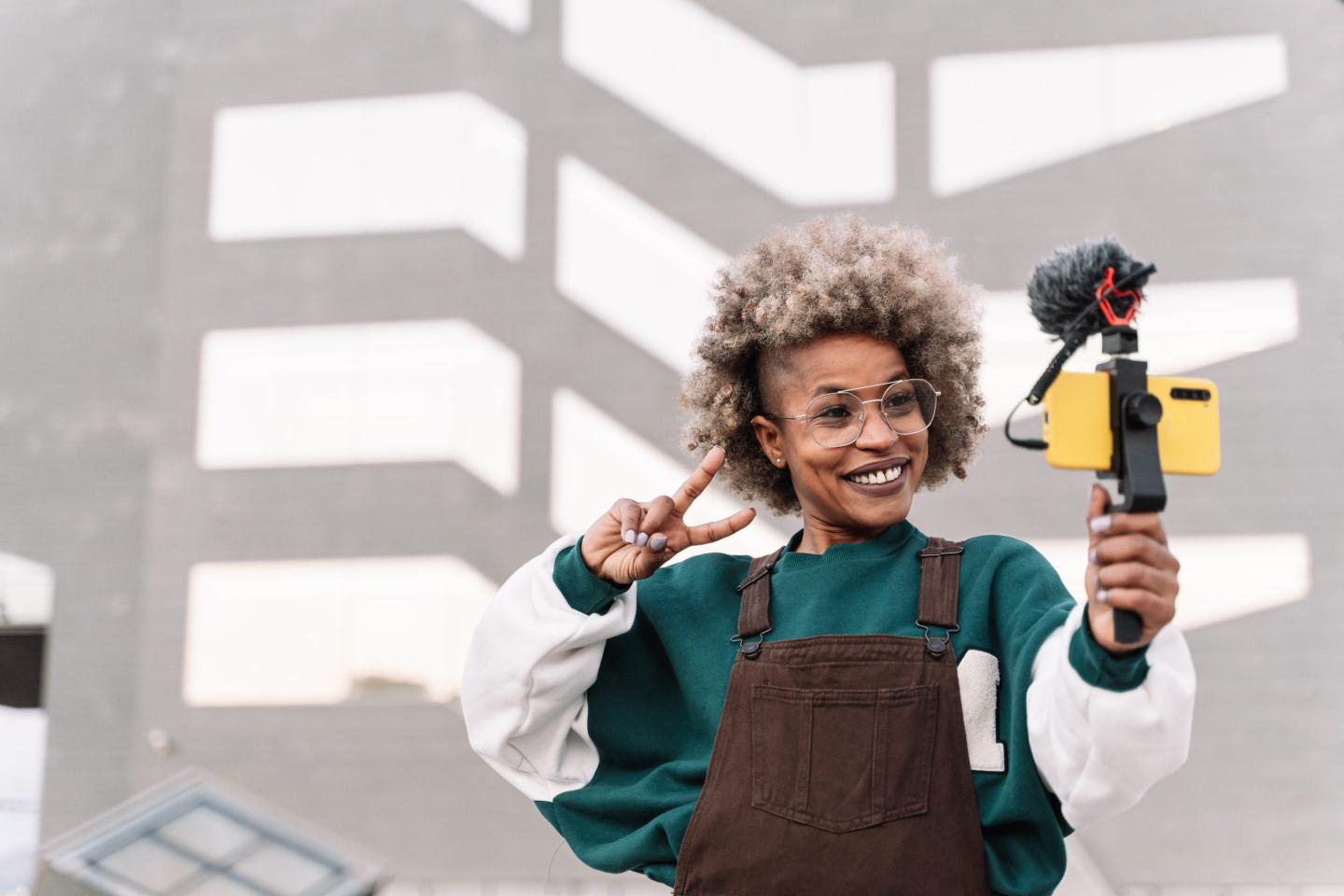 Female influencer filming herself
