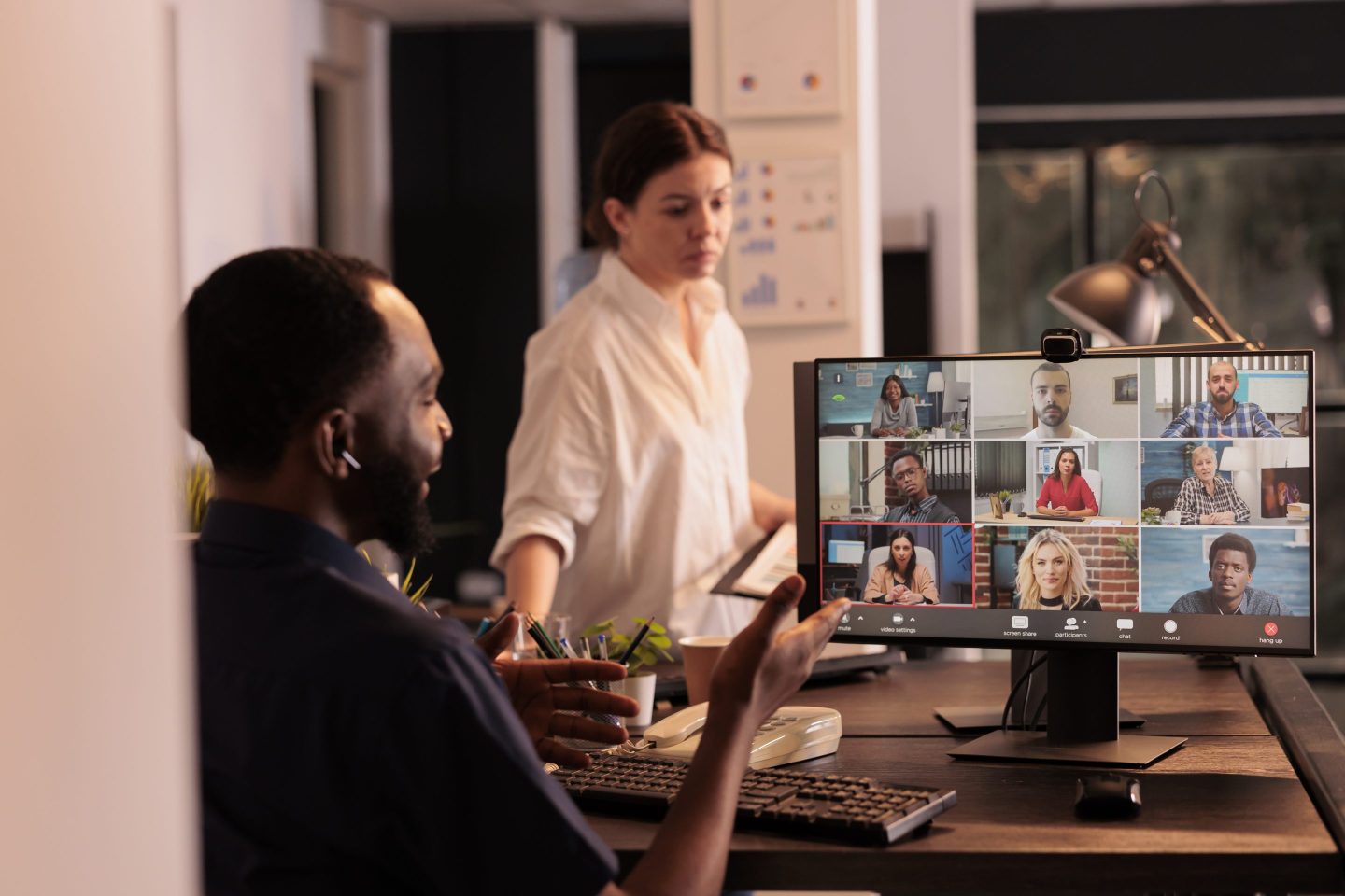 African american employee talking on teleconference, using videocall app.