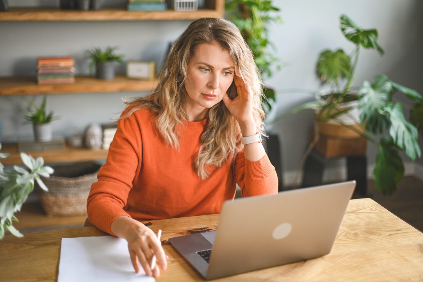 Concerned woman sitting at computer