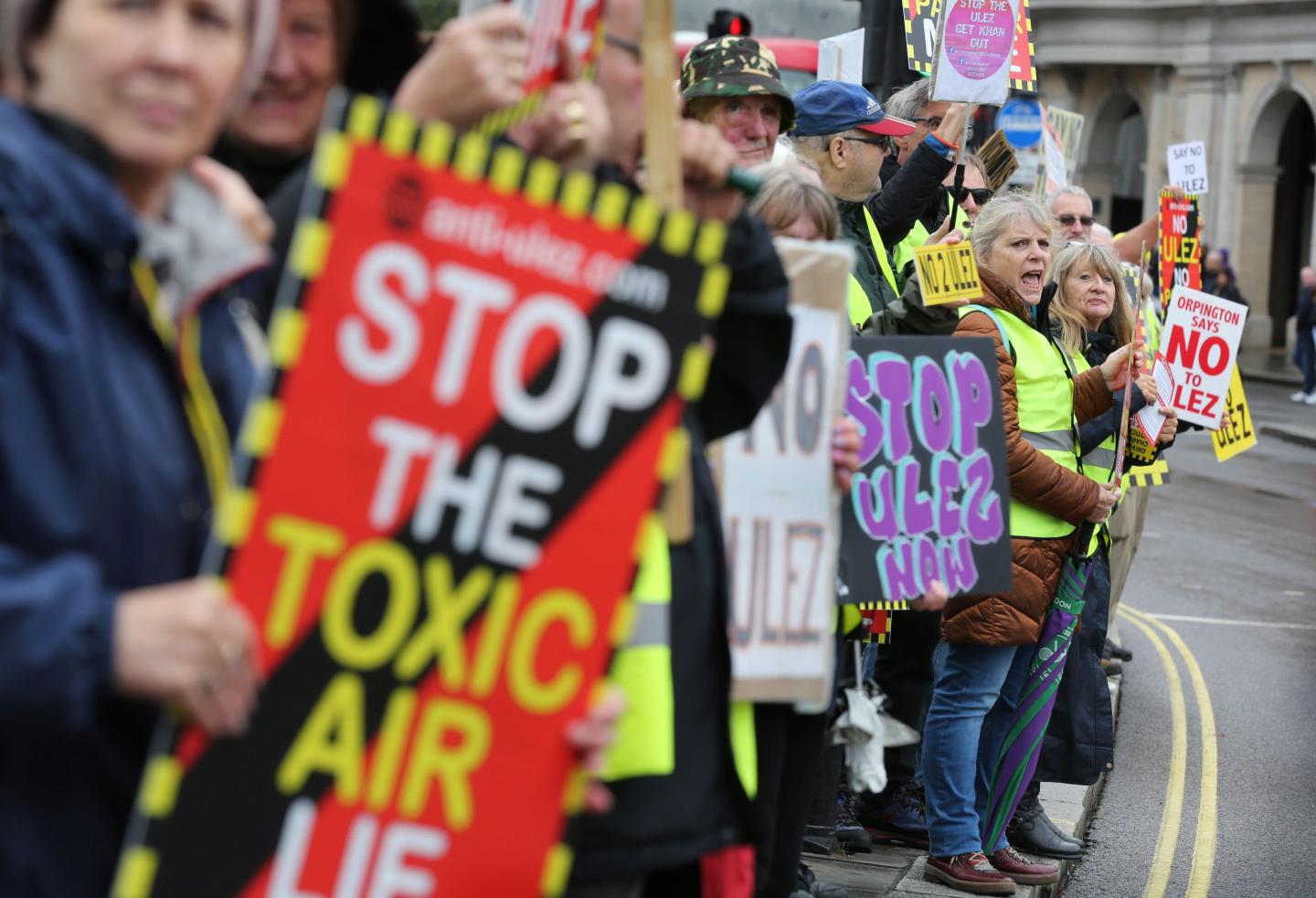 Protesters gather with signs, whistles and loud voices to object to the extension of the Ultra Low Emissions Zone (ULEZ) at Trafalgar Square on August 5, 2023 in London.
