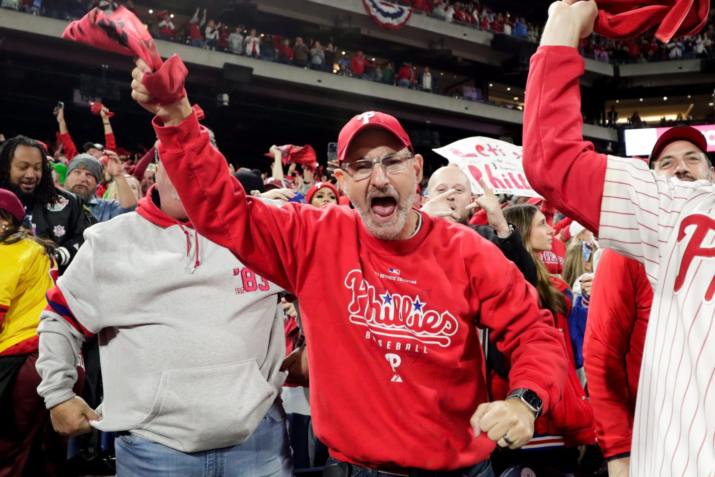 Older man in red shirt and hat