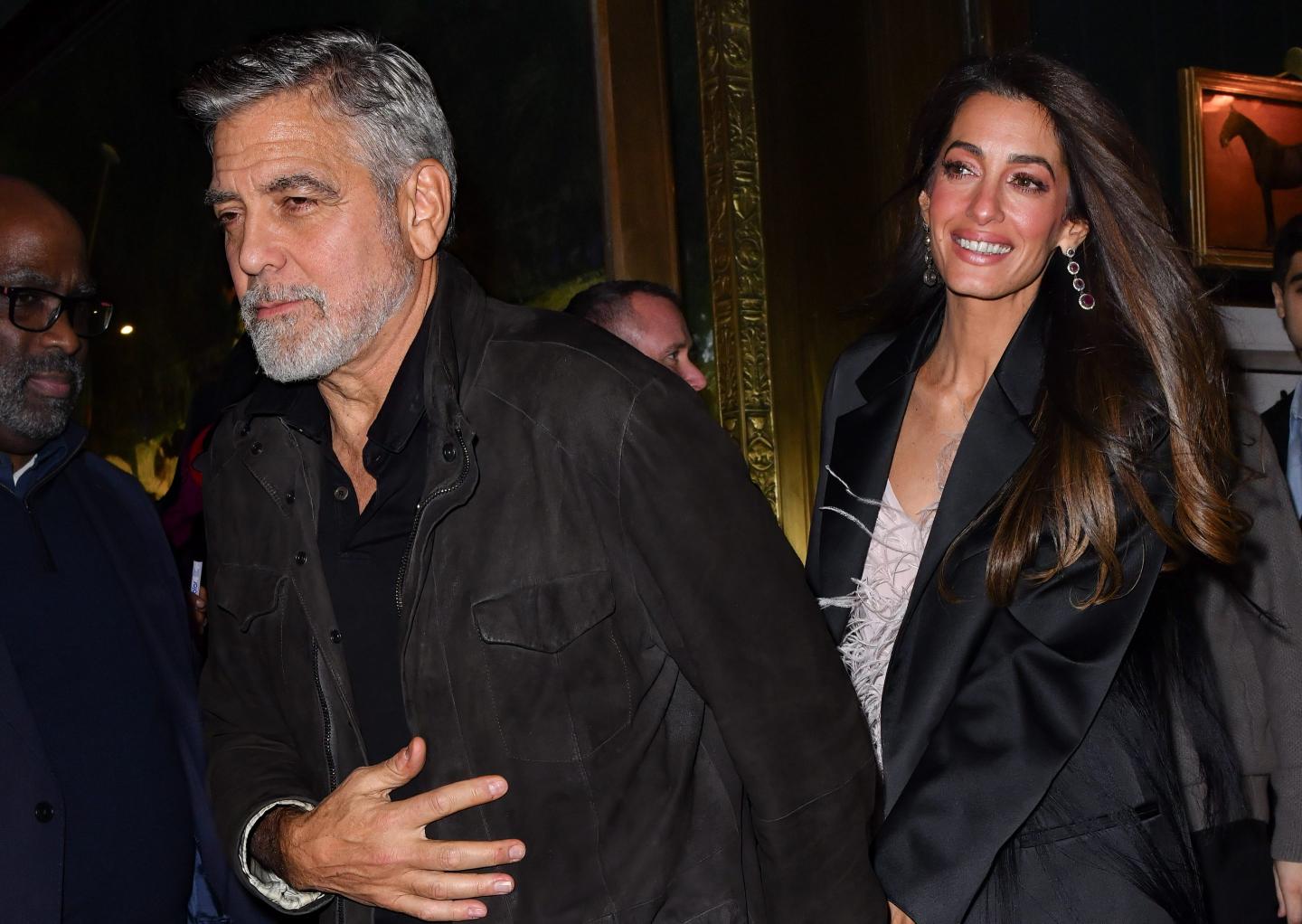 George Clooney and Amal Clooney leave the Polo Bar on December 14, 2023 in New York City.