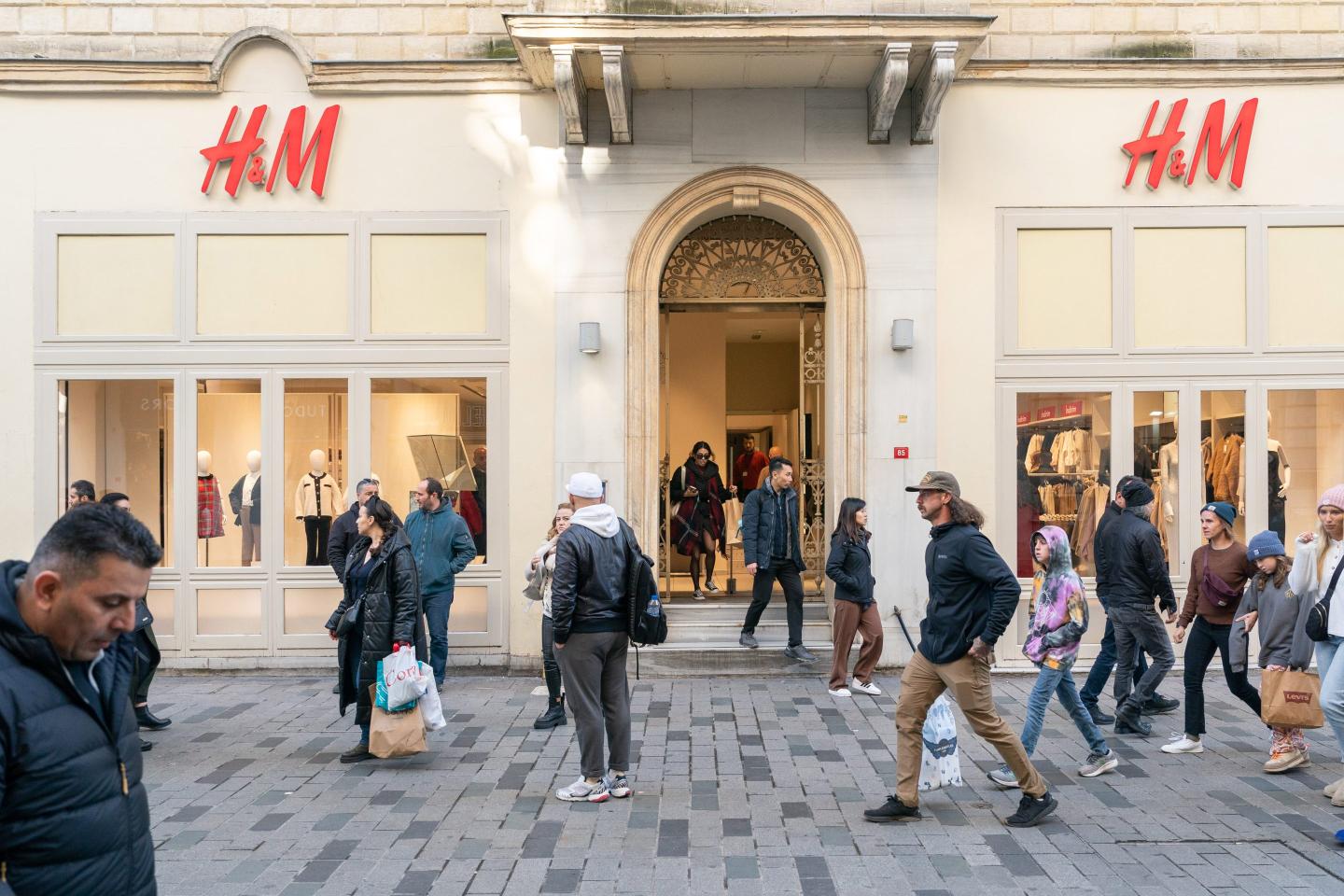 people seen walking on a busy street