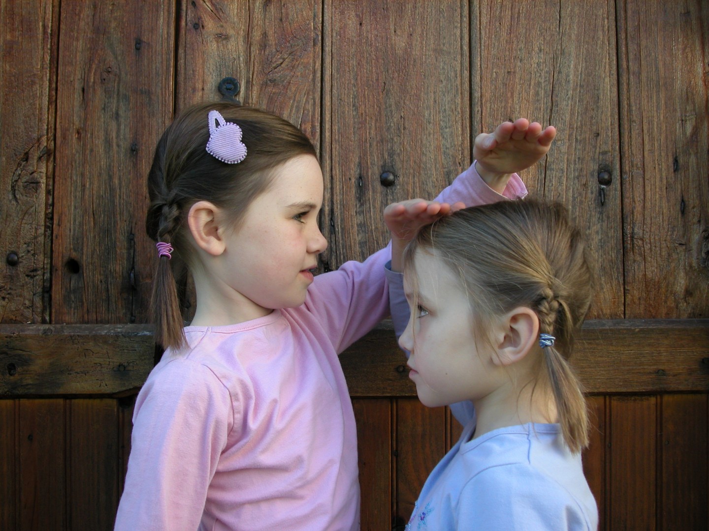 Two young girls looking at each other