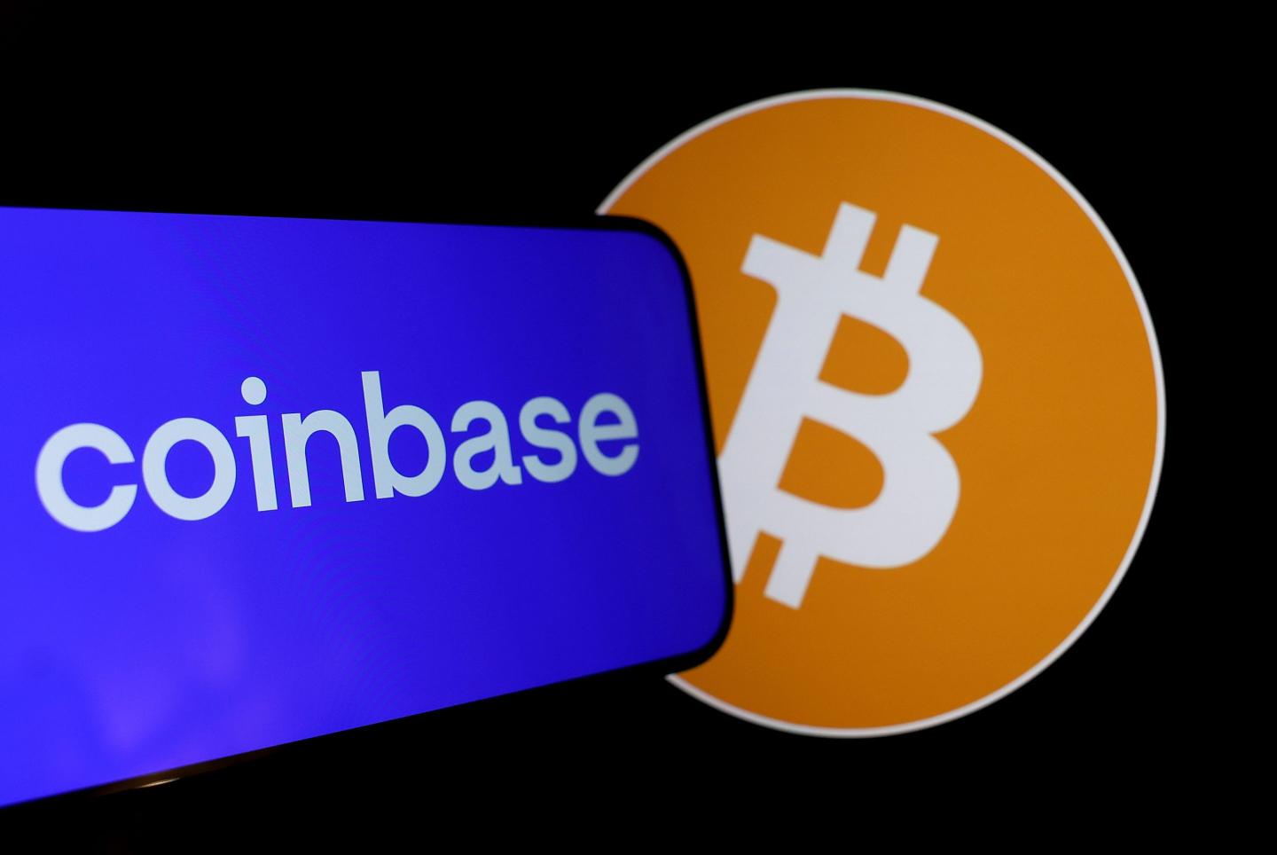Photo showing the logos of Coinbase and Bitcoin overlapping