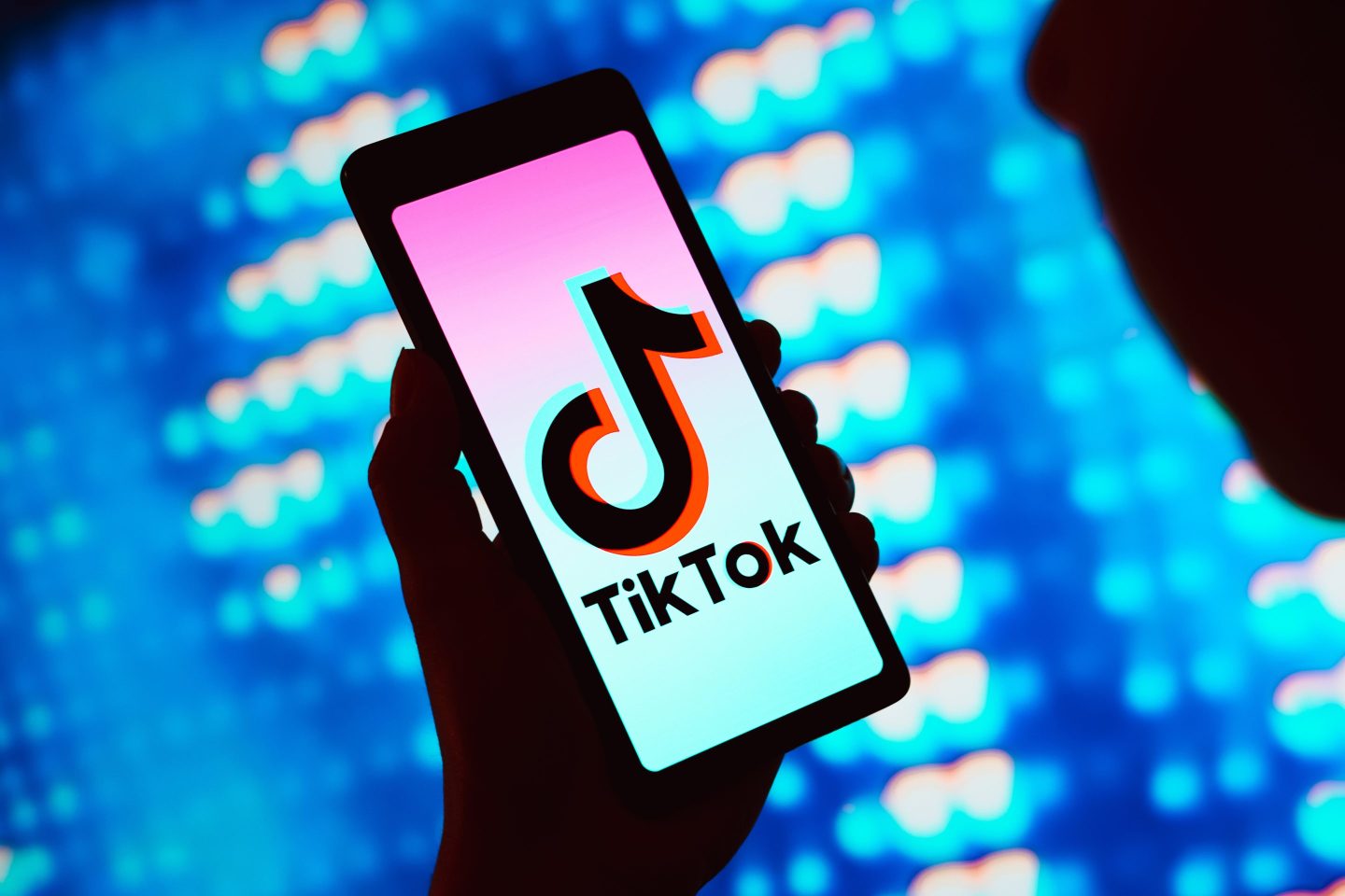 In this photo illustration, the TikTok logo is displayed on a smartphone screen.