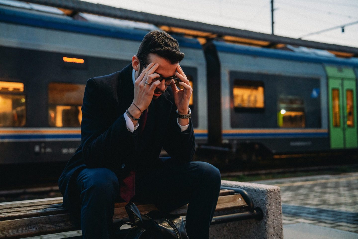 Man stressed waiting for train