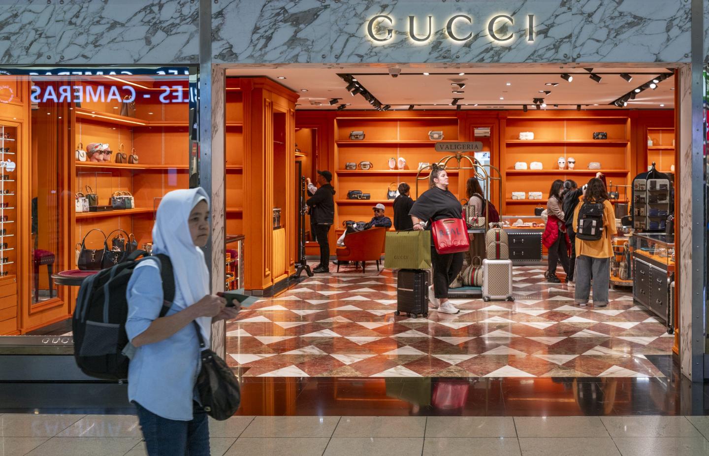 people shopping at a luxury store