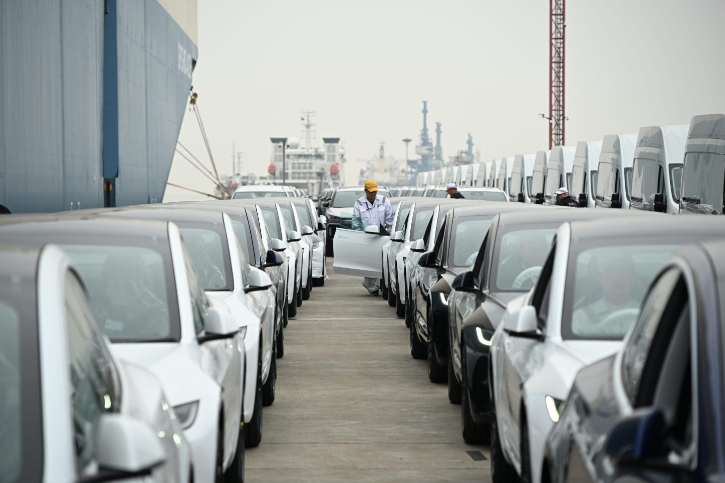 Tesla's new Model 3 sedans wait to be shipped aboard at Shanghai Haitong International Automotive Terminal on March 14, 2024 in Shanghai.