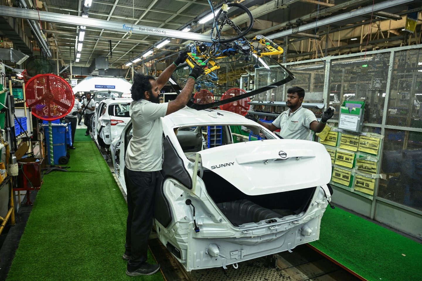 Employees work at the joint manufacturing facility of Renault Nissan Automotive India in an industrial suburb of Chennai, India, this week.