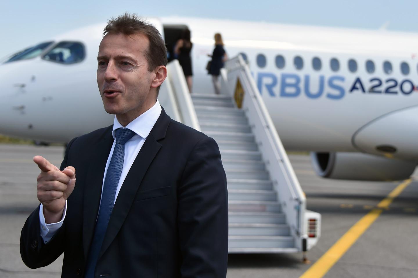 Guillaume Faury, CEO of Airbus, poses in front of the new Airbus A220-300 during its presentation