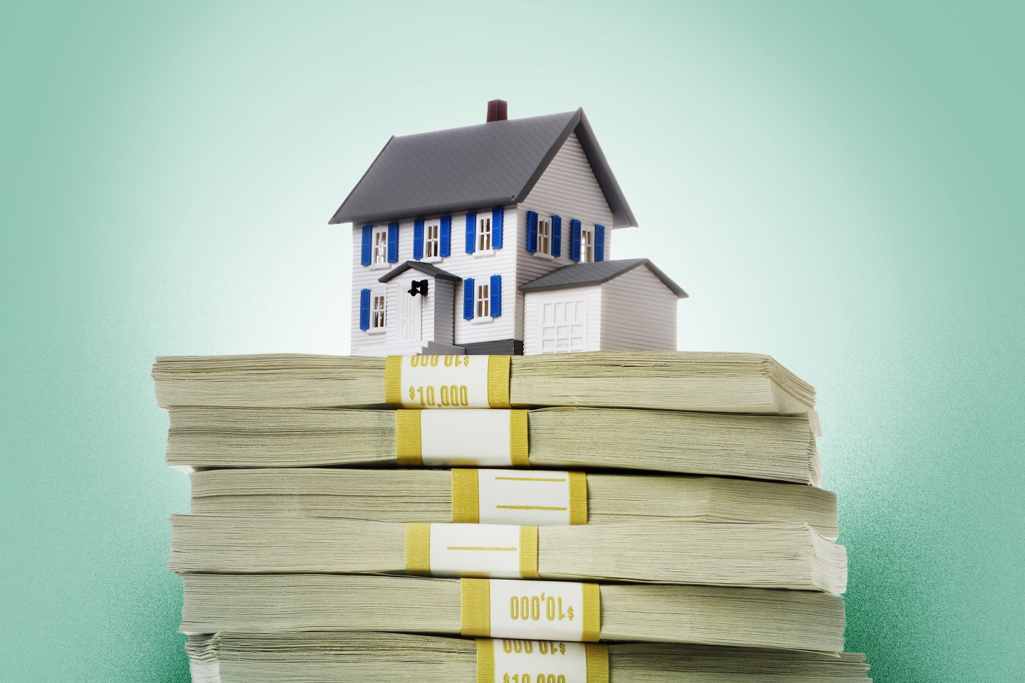 House on top of stack of money