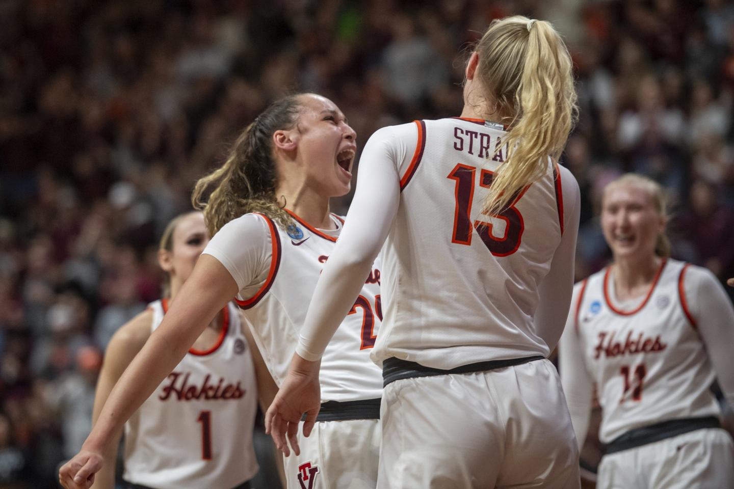Virginia Tech's Olivia Summiel, left, celebrates with Clara Strack (13) during the first half of a second-round college basketball game against Baylor in the women's NCAA Tournament in Blacksburg, Va., on March 24, 2024. 