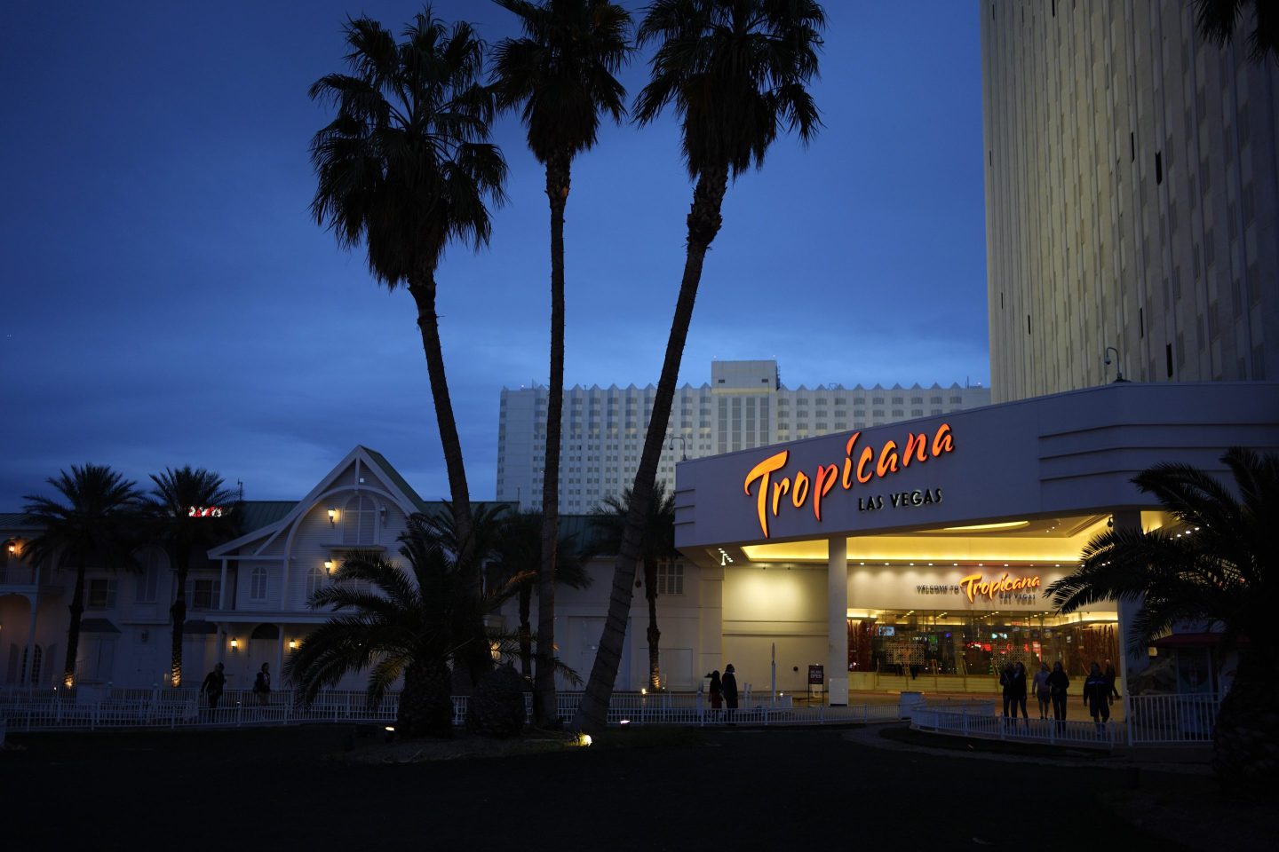 People walk outside of the Tropicana hotel-casino on March 28, 2024, in Las Vegas.