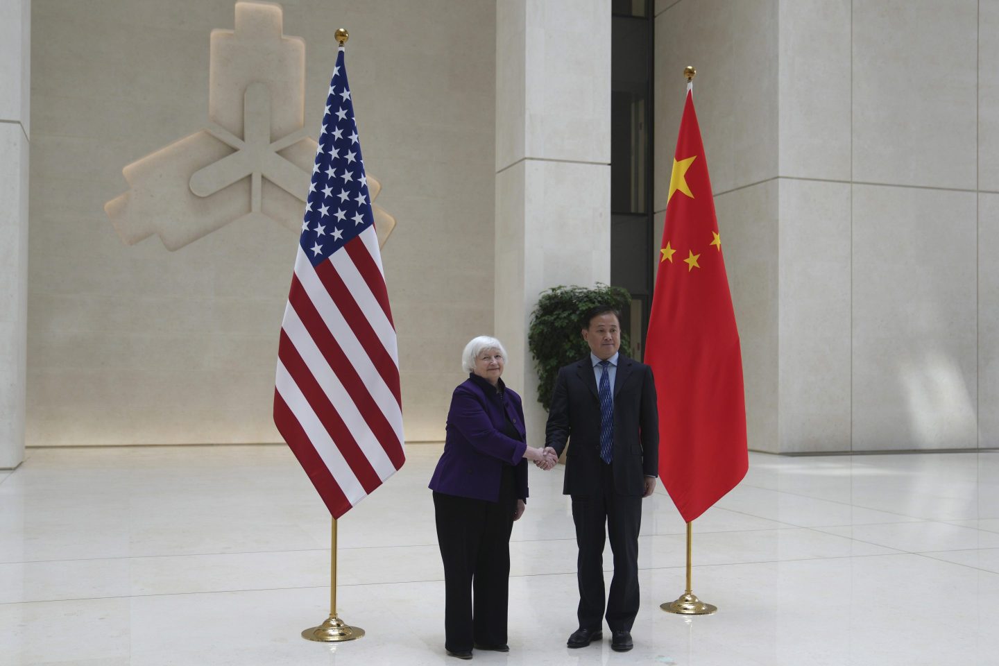 Treasury Secretary Janet Yellen, left, shakes hands with Governor of the People's Bank of China Pan Gongsheng as they meet at the People's Bank of China in Beijing on April 8, 2024.