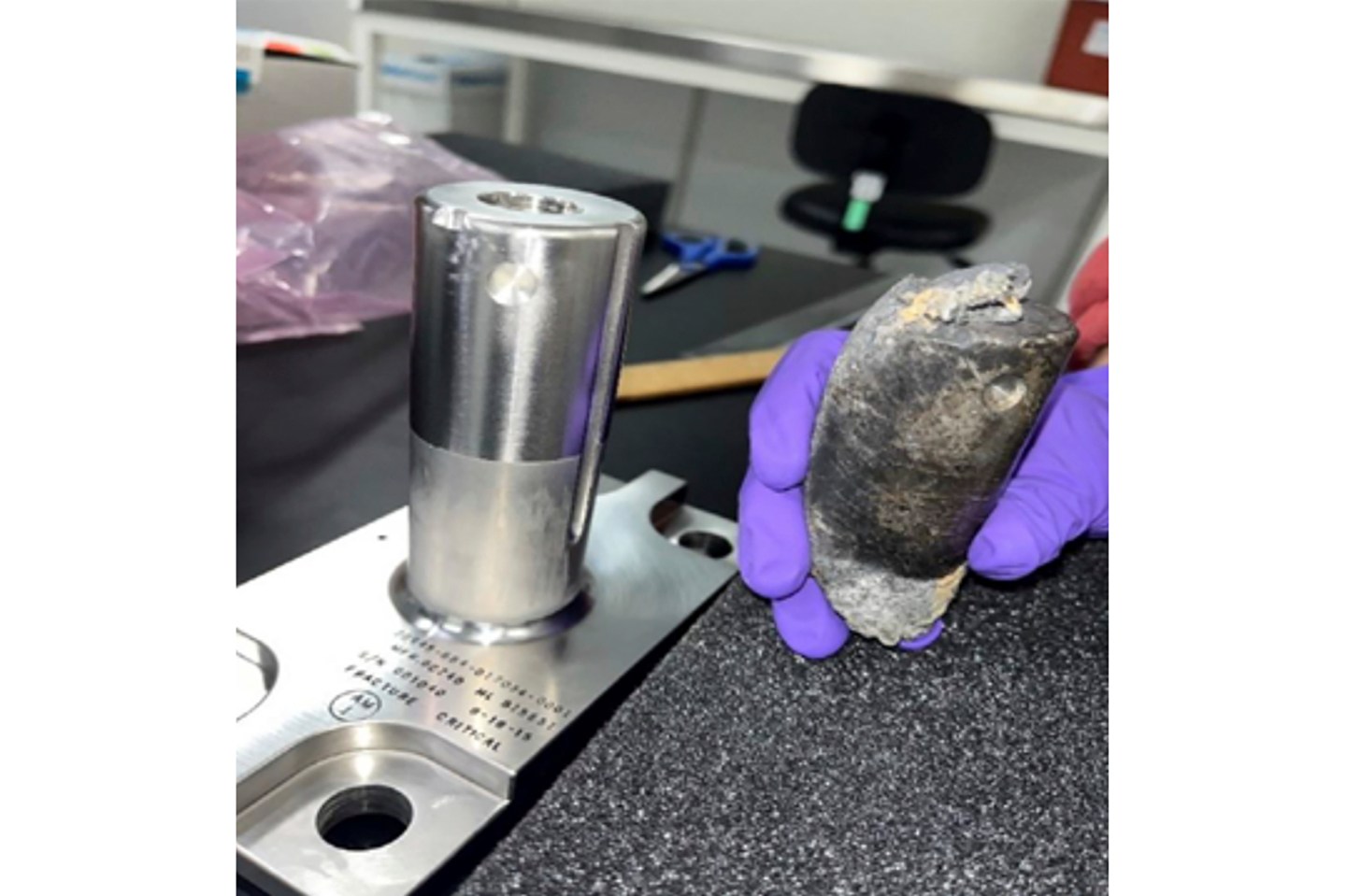 This undated photo provided by NASA shows a recovered chunk of space junk from equipment discarded at the International Space Station.